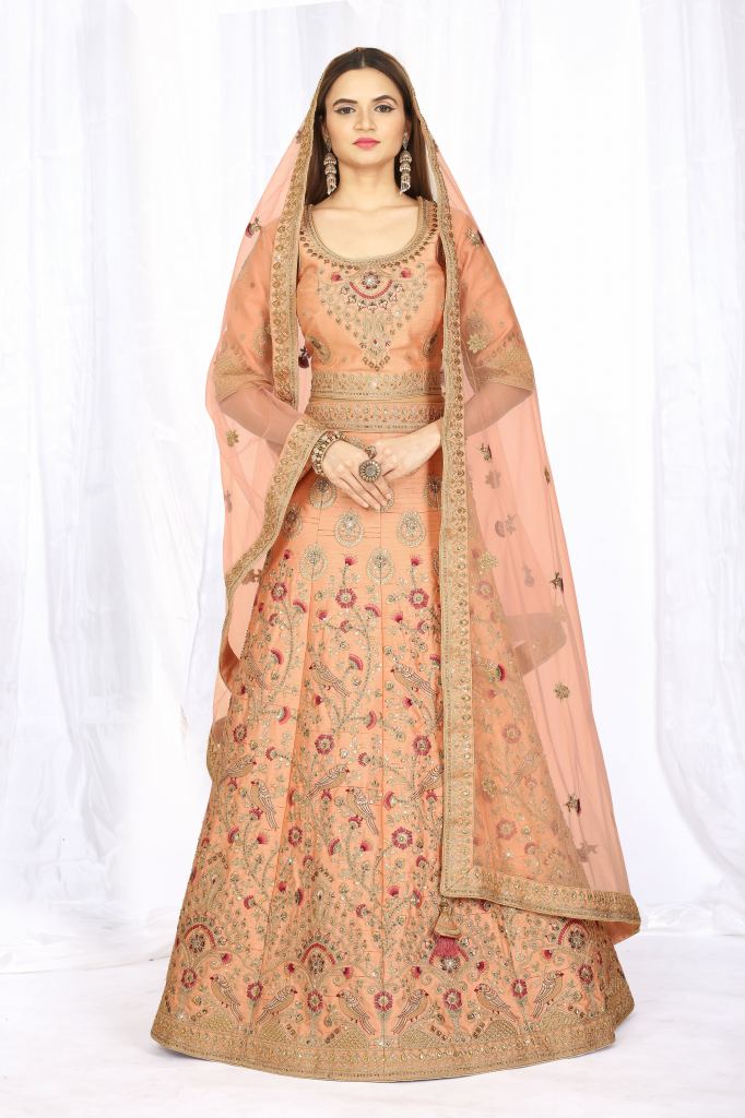 PASTEL PEACH OMBRÉ BANARASI LEHENGA SET WITH A GOTA EMBROIDERED BLOUSE  PAIRED WITH A MATCHING SHADED BANARASI DUPATTA AND GOLD DETAILS. - Seasons  India